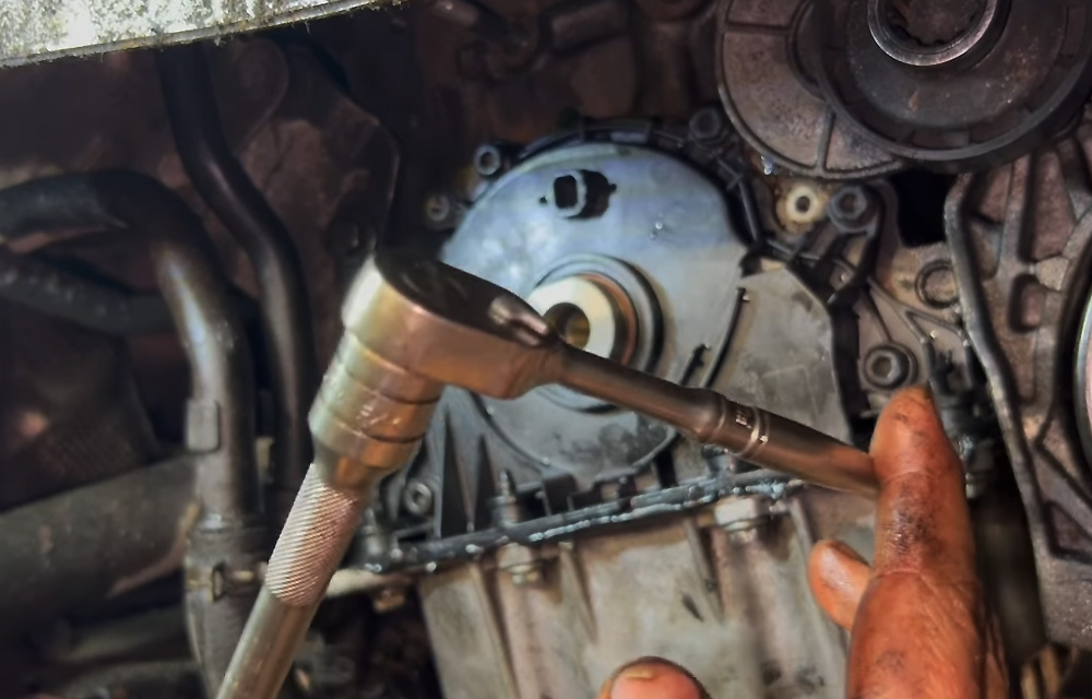 Avoid tightening with the timing tool in place to prevent damage to the plastic locator.